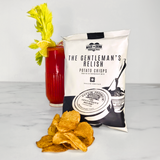 A 40g pack of Made For Drink's The Gentleman's Relish potato crisps with a pile of crisp in front and a Bloody Mary on a highball glass with celery, lemon and lime garnish.