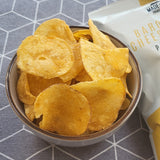 A bowl of Made For Drink's Baron Bigod Cheese & Onion Crisps with a 40g pack in the background.