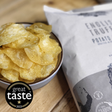 A bowl of Made For Drink's award-winning English Truffle flavoured English Heritage potato crisps with a 150g pack in the background. Great Taste One Star Award 2023.